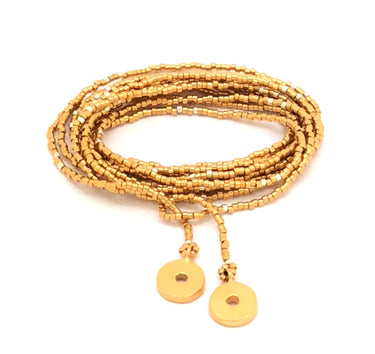 Collar enredable dorado detalles plata.